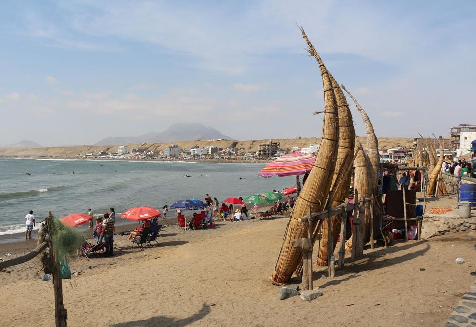 Totora reed boats stood upright on Huanchaco beach