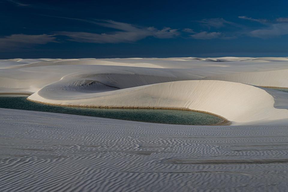 White dunes with a blue rainwater lagoon