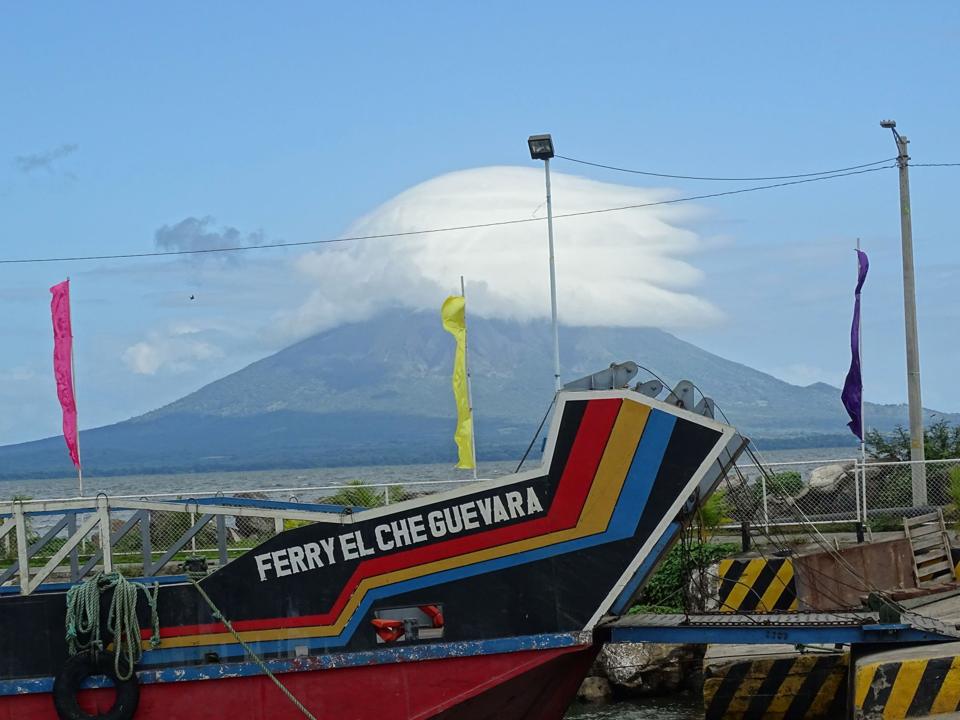 Painted ferry at the dock with Concepción volcano behind